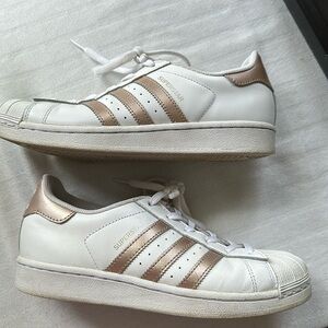 Adidas Women Superstar Sneakers with gold three stripes